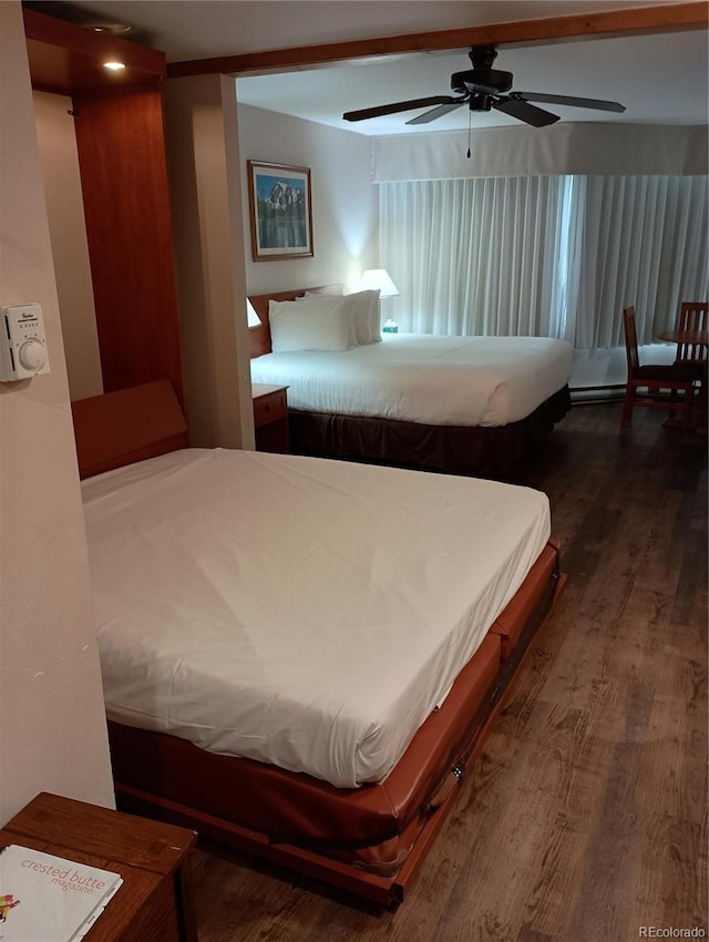 bedroom with ceiling fan and dark hardwood / wood-style floors