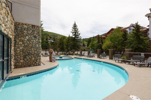 6 Emmons Rd Unit 515, Mount Crested Butte, CO 81225 - community pool with a patio and a community hot tub