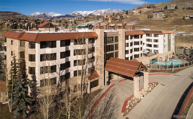 6 Emmons Rd Unit 515, Mount Crested Butte, CO 81225 - view of building exterior featuring a mountain view