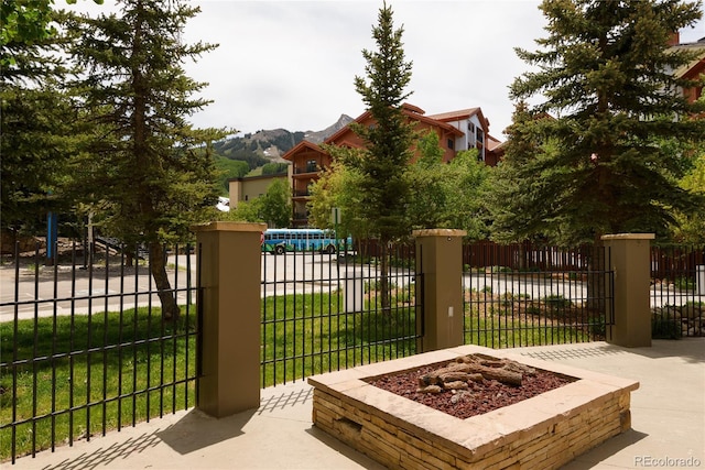 6 Emmons Rd Unit 515, Mount Crested Butte, CO 81225 - gate featuring a mountain view and an outdoor fire pit