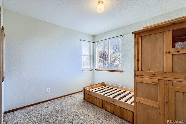 unfurnished bedroom with light colored carpet