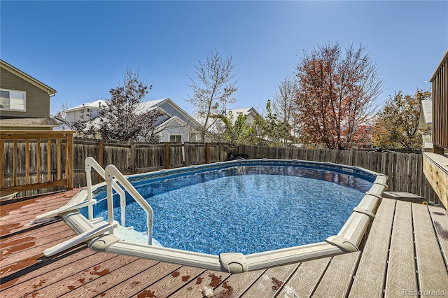 view of swimming pool featuring a deck