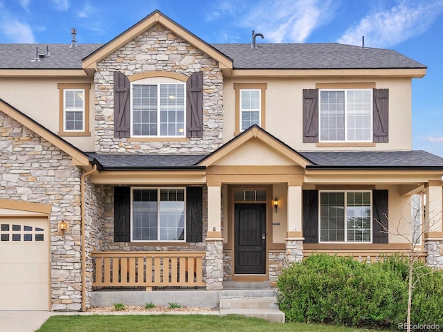 2463 Tavern Way, Castle Rock, CO 80104 - view of front of property featuring stone siding, a porch, and stucco siding