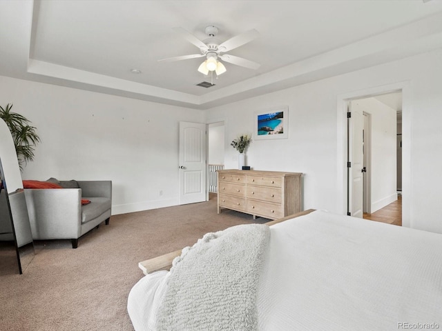 2463 Tavern Way, Castle Rock, CO 80104 - bedroom featuring a raised ceiling, baseboards, carpet flooring, and a ceiling fan