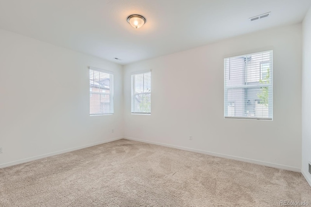 8433 Mount Kataka Loop, Littleton, CO 80125 - unfurnished room featuring baseboards, light carpet, and visible vents