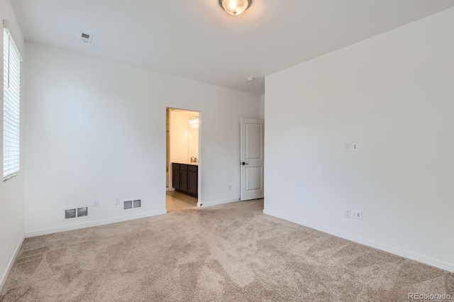8433 Mount Kataka Loop, Littleton, CO 80125 - unfurnished bedroom with baseboards, visible vents, and light colored carpet