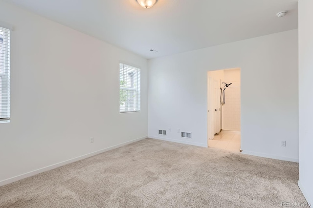 8433 Mount Kataka Loop, Littleton, CO 80125 - unfurnished room with baseboards, visible vents, and light colored carpet