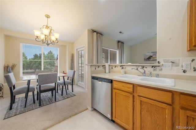 kitchen with dishwasher, lofted ceiling, sink, hanging light fixtures, and a notable chandelier