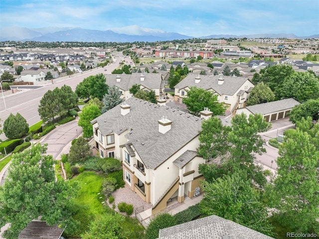 birds eye view of property featuring a mountain view