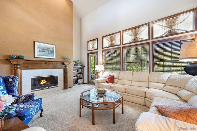 9873 Greensview Cir, Lone Tree, CO 80124 - carpeted living room with healthy amount of natural light, high vaulted ceiling, and a tile fireplace