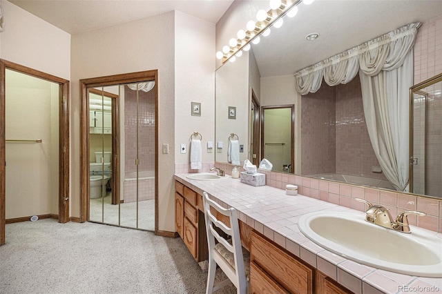 9873 Greensview Cir, Lone Tree, CO 80124 - full bath with double vanity, a tile shower, and a tub