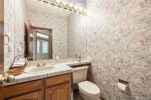 9873 Greensview Cir, Lone Tree, CO 80124 - bathroom featuring wallpapered walls and vanity