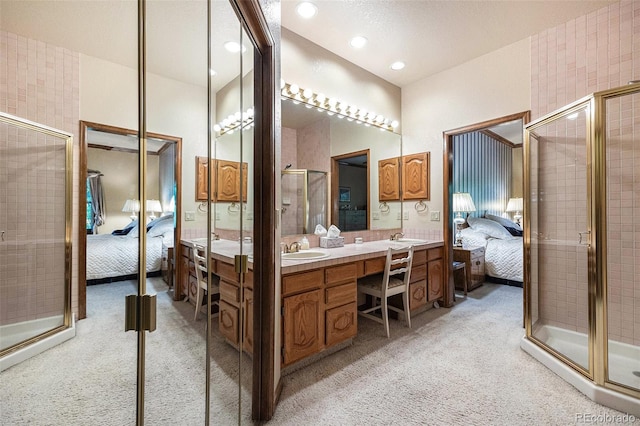 9873 Greensview Cir, Lone Tree, CO 80124 - full bath with ensuite bath, a stall shower, double vanity, and recessed lighting