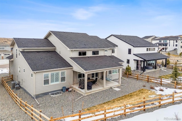 rear view of property with a patio and cooling unit