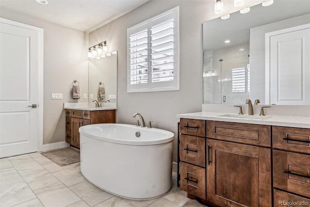 bathroom featuring shower with separate bathtub and vanity