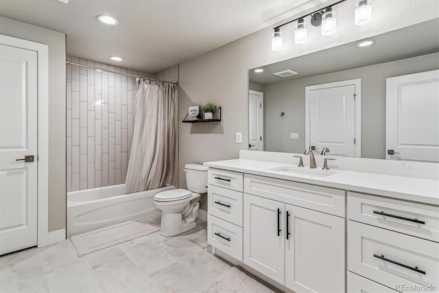 full bathroom featuring shower / bath combination with curtain, vanity, and toilet