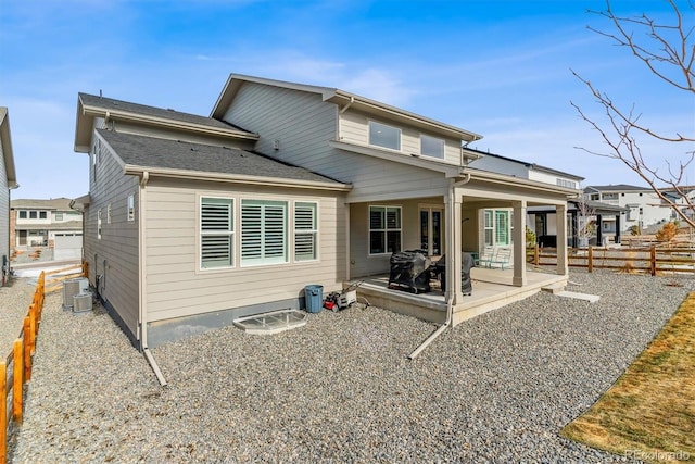 back of property featuring central AC unit and a patio area