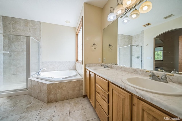 bathroom featuring vanity, separate shower and tub, and tile patterned floors