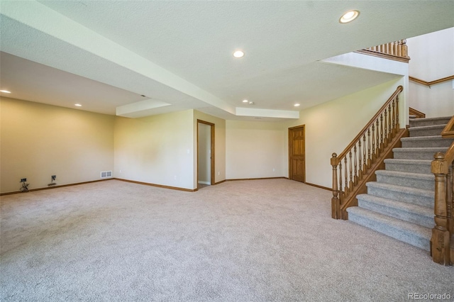 interior space with carpet and a textured ceiling