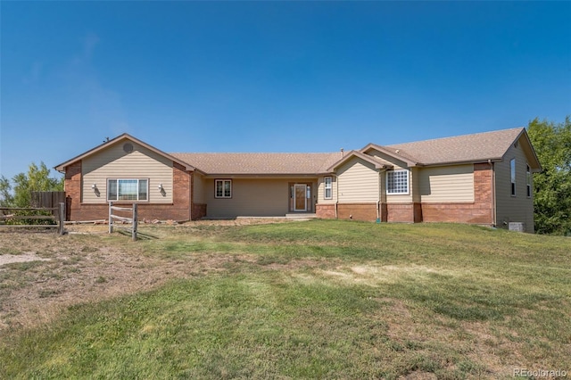 ranch-style home with a front lawn