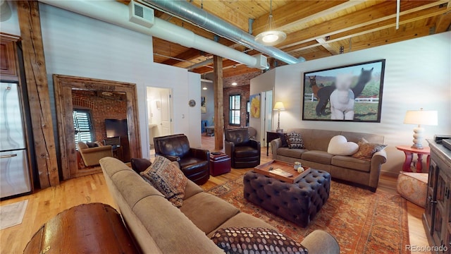 1745 Wazee St Unit 4H, Denver, CO 80202 - living area featuring a wood ceiling with exposed beams and wood finished floors