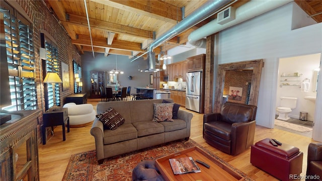 1745 Wazee St Unit 4H, Denver, CO 80202 - living room featuring light wood-type flooring, a wooden ceiling with exposed beams, and a high ceiling