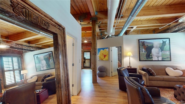 1745 Wazee St Unit 4H, Denver, CO 80202 - living room with a wood ceiling with exposed beams and light wood finished floors