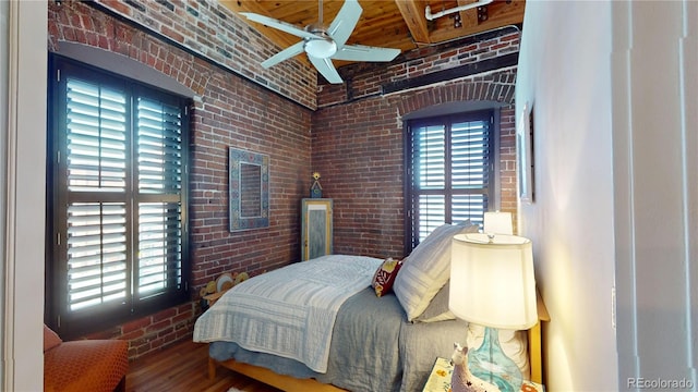 1745 Wazee St Unit 4H, Denver, CO 80202 - bedroom featuring brick wall and wood finished floors