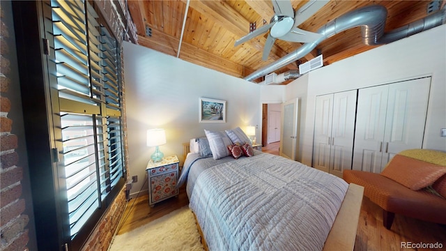 1745 Wazee St Unit 4H, Denver, CO 80202 - bedroom with light wood-style floors, a wood ceiling with exposed beams, a closet, and a ceiling fan