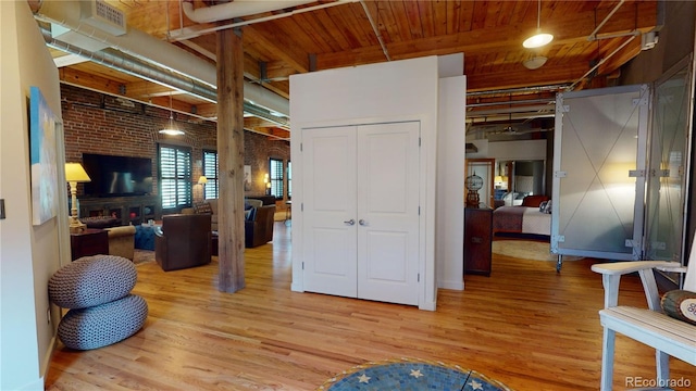 1745 Wazee St Unit 4H, Denver, CO 80202 - bedroom with light wood-type flooring and wood ceiling