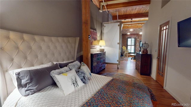 1745 Wazee St Unit 4H, Denver, CO 80202 - bedroom featuring wood finished floors and a wood ceiling with exposed beams