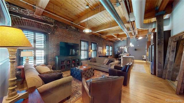 1745 Wazee St Unit 4H, Denver, CO 80202 - living area featuring light wood finished floors, a wood ceiling with exposed beams, and brick wall