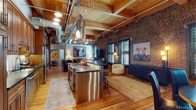 1745 Wazee St Unit 4H, Denver, CO 80202 - kitchen featuring light wood finished floors, open floor plan, a wood ceiling with exposed beams, island exhaust hood, and brick wall