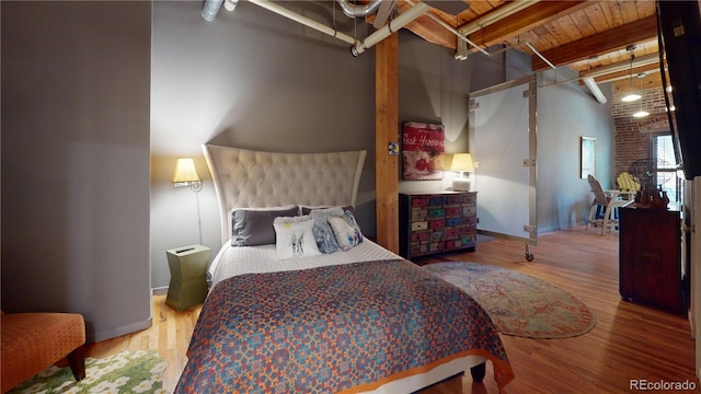 1745 Wazee St Unit 4H, Denver, CO 80202 - bedroom with wood finished floors and a wood ceiling with exposed beams