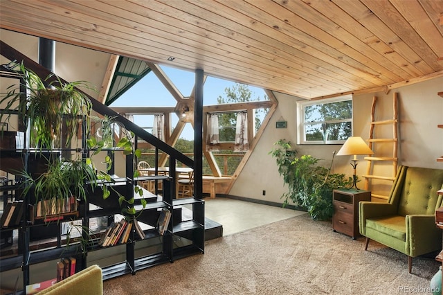 sunroom featuring lofted ceiling and wooden ceiling