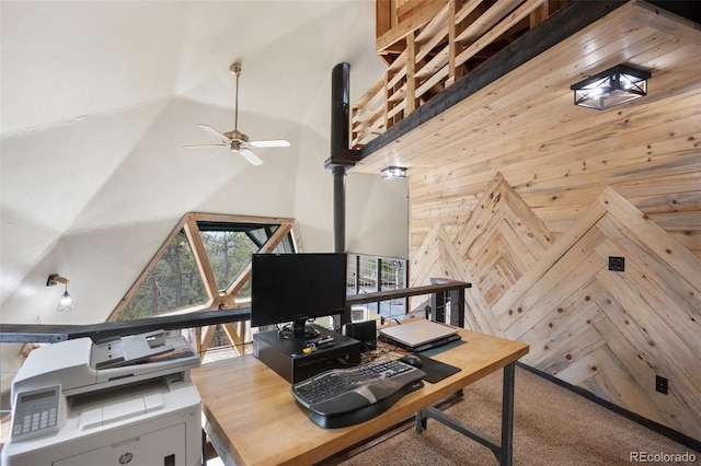 home office with ceiling fan and a towering ceiling