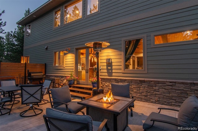 view of patio / terrace featuring an outdoor fire pit