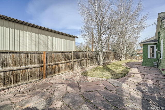 view of yard featuring a patio and a fenced backyard