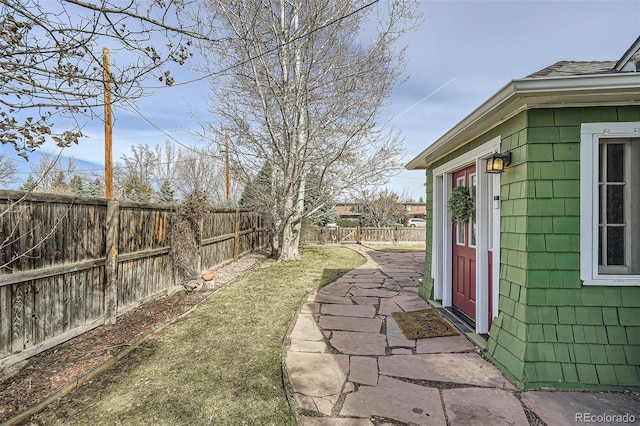 view of yard featuring a patio area and a fenced backyard