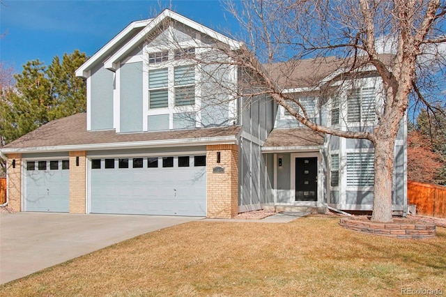 traditional-style house with a garage, brick siding, a shingled roof, driveway, and a front yard