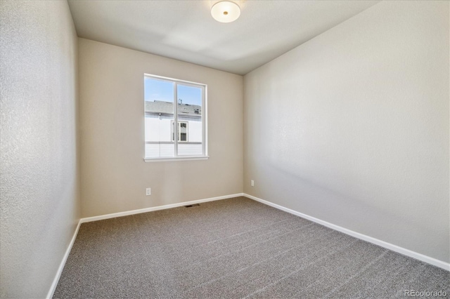 unfurnished room with carpet floors