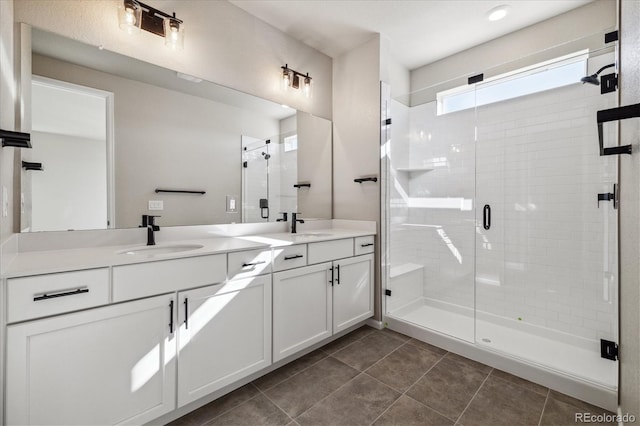 bathroom with tile patterned flooring, vanity, and an enclosed shower