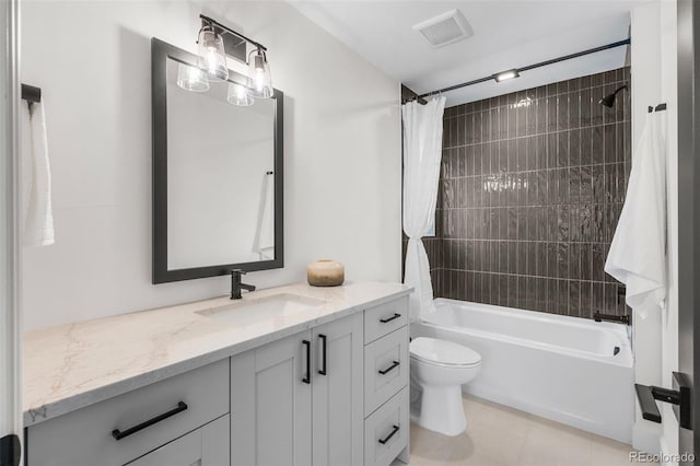 full bathroom with tile patterned flooring, vanity, toilet, and shower / bathtub combination with curtain