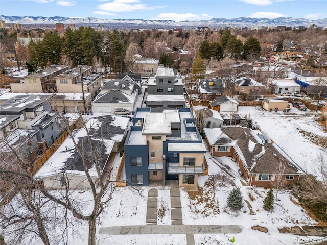 snowy aerial view with a mountain view