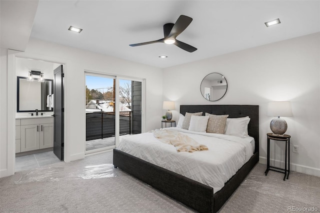 carpeted bedroom with connected bathroom, access to outside, ceiling fan, and sink