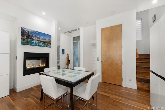 dining room with dark hardwood / wood-style floors