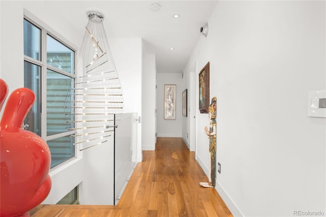 hallway with wood-type flooring