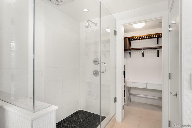 bathroom featuring walk in shower and tile patterned floors