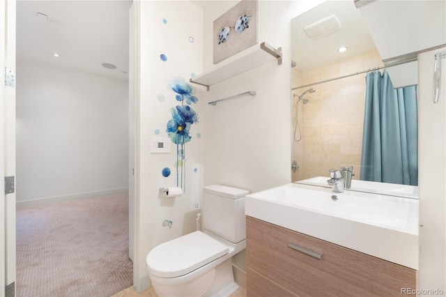 bathroom with toilet, vanity, and curtained shower