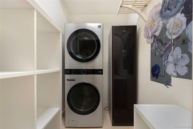 washroom with stacked washer and dryer